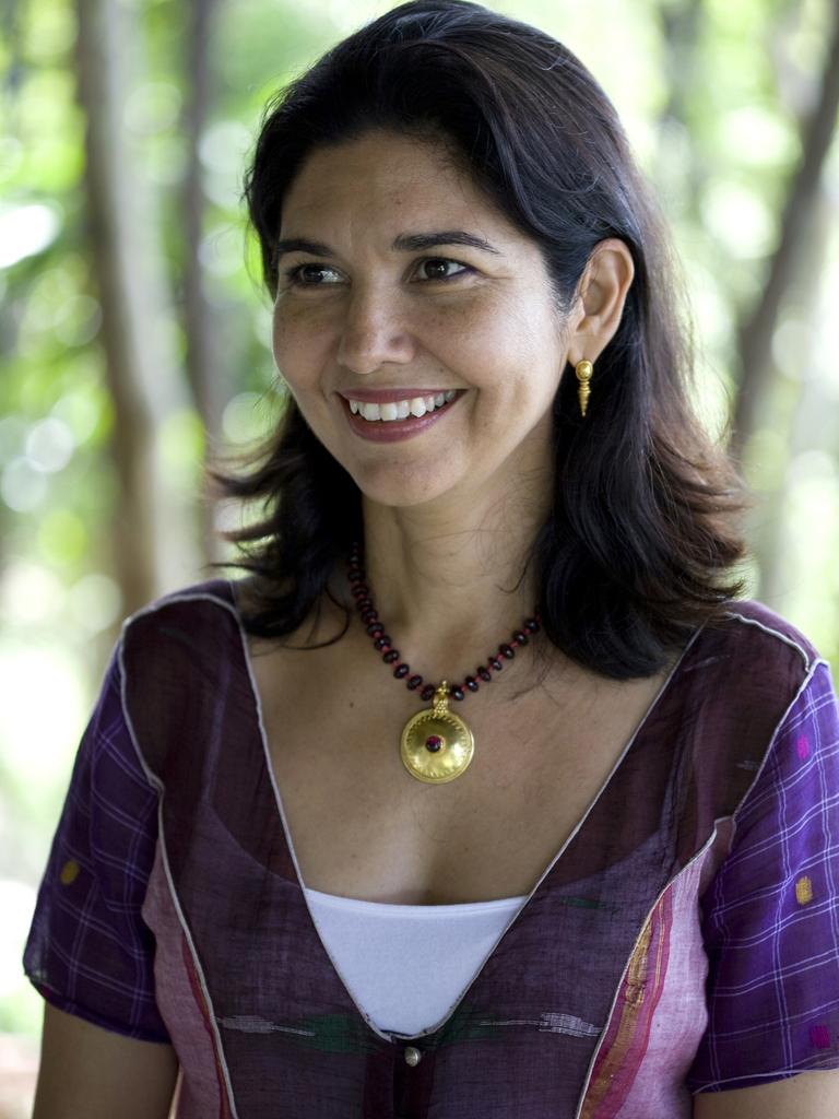 Karina Stewart (Kamalaya Koh Samui) smiling into the distance, trees and greenery in the background behind her